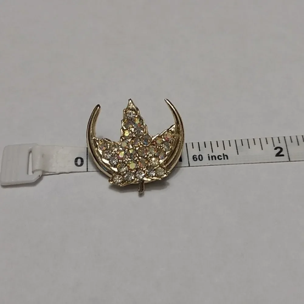 Gold tone rhinestone leaf brooch